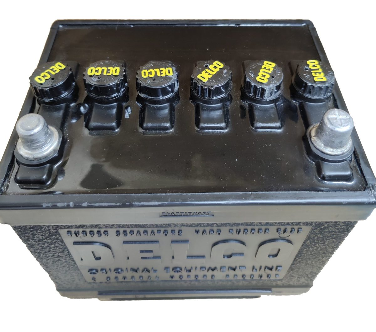 Delco Group 22D Battery top with Black Caps and Yellow Letters